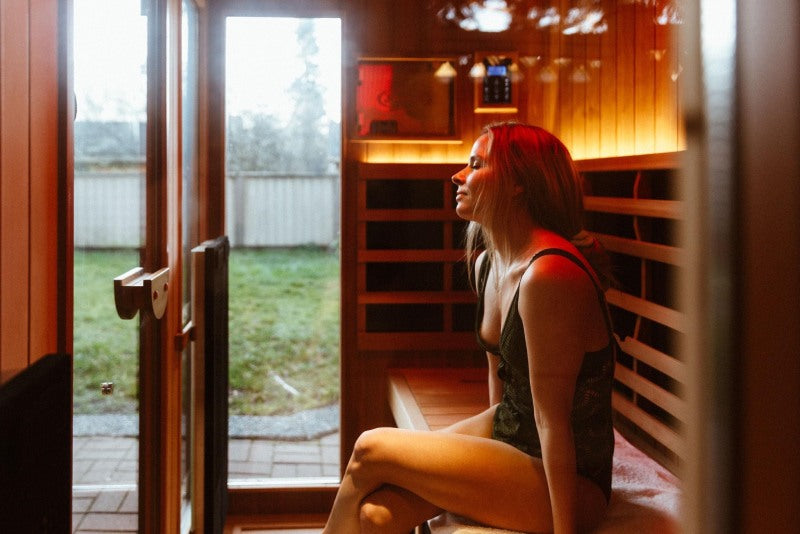 Woman relaxing in an Infrared sauna