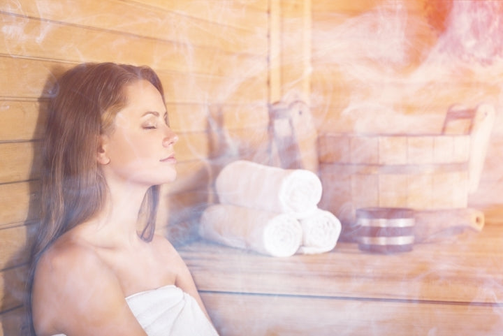 Girl relaxing in a sauna