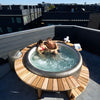 Couple enjoying their Softub 300 Portico hot tub
